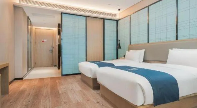 Bed in Echarm Hotel Liuzhou Liunan Wanda Plaza