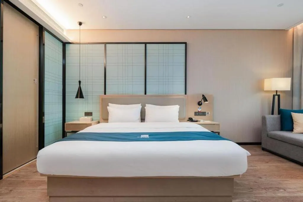 Bed in Echarm Hotel Liuzhou Liunan Wanda Plaza