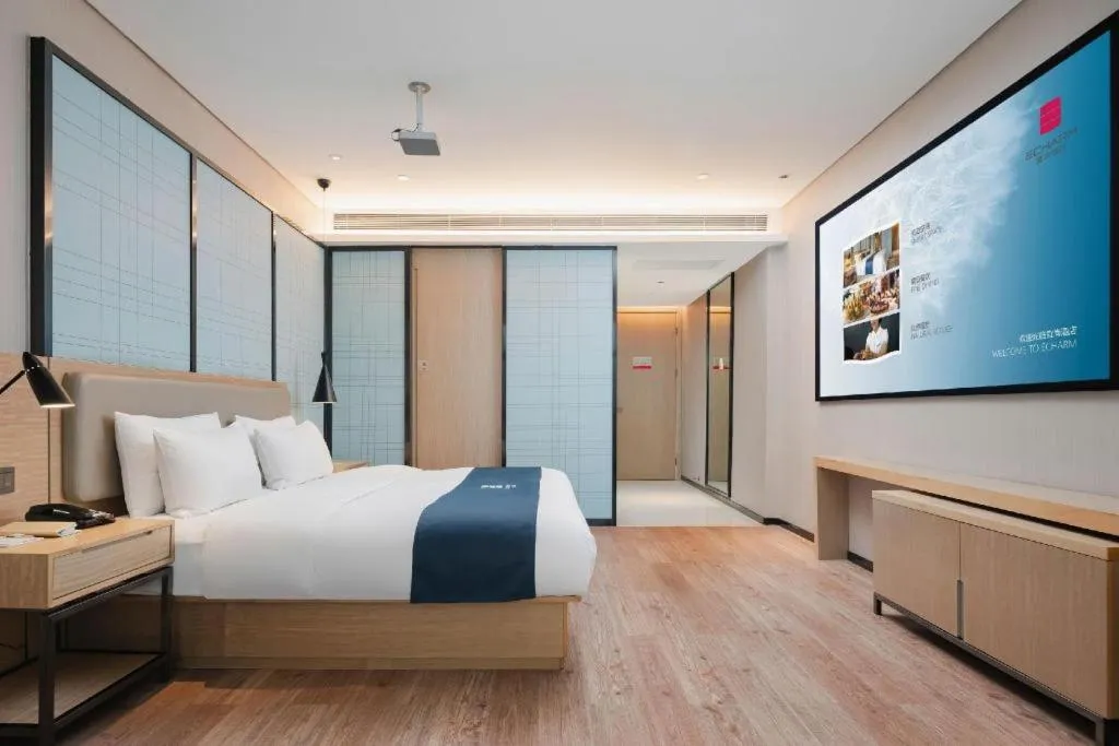 Bed in Echarm Hotel Liuzhou Liunan Wanda Plaza