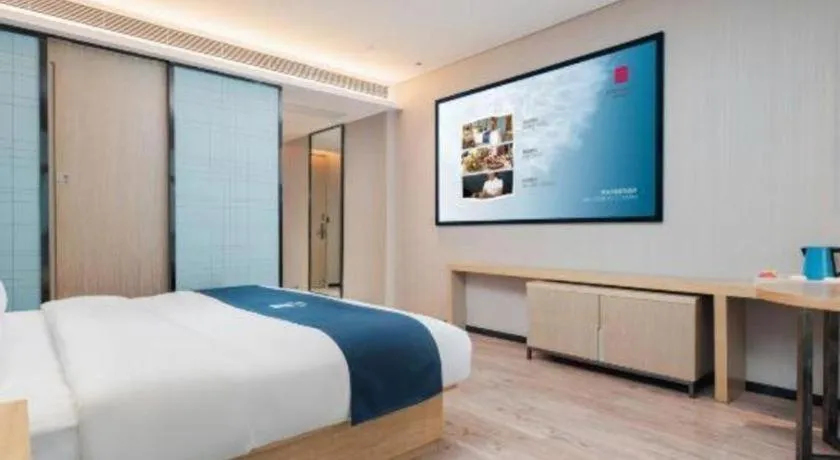 Bed in Echarm Hotel Liuzhou Liunan Wanda Plaza
