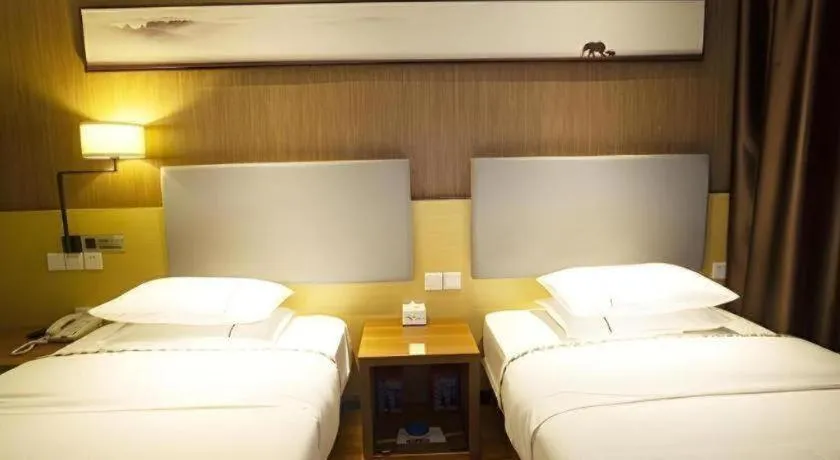 Bed in Jtour Inn Huanggang Wuxue City Square