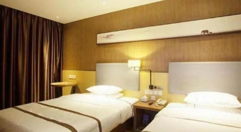 Bed in Jtour Inn Huanggang Wuxue City Square