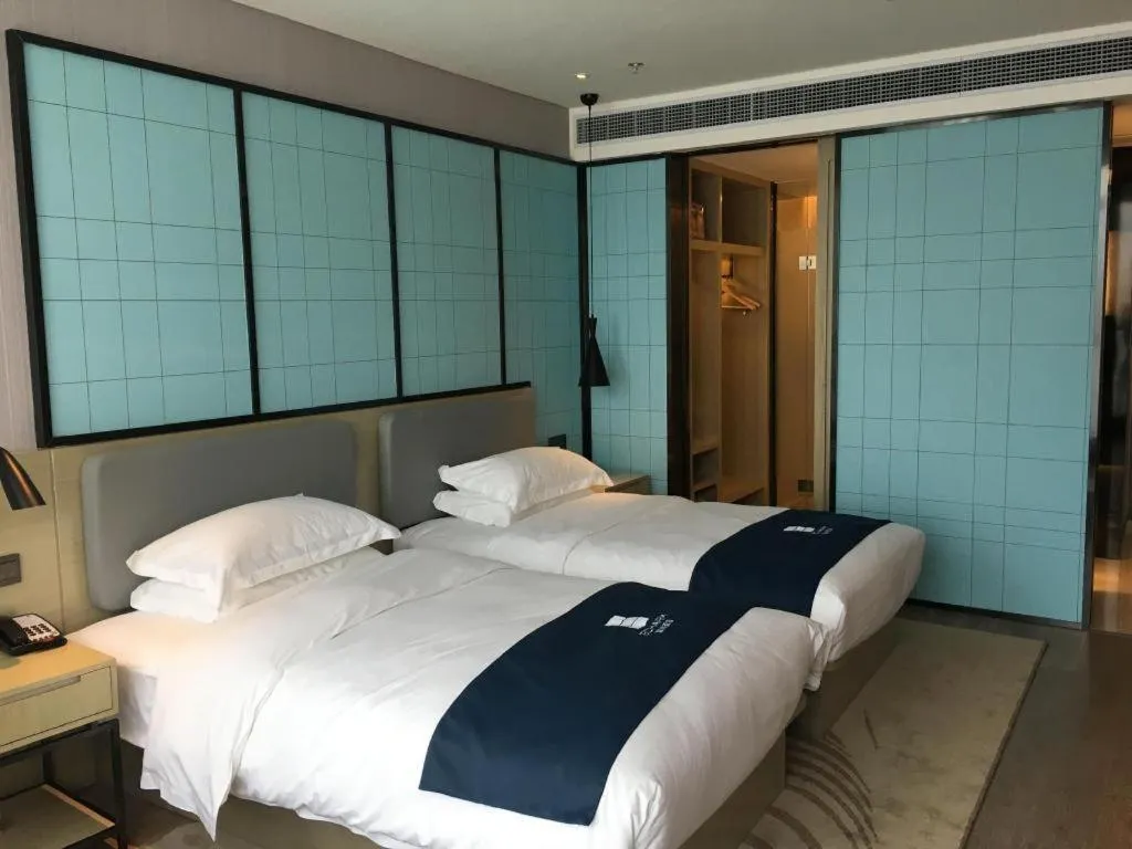 Bed in Echarm Hotel An'xi Hengxing Coach Station