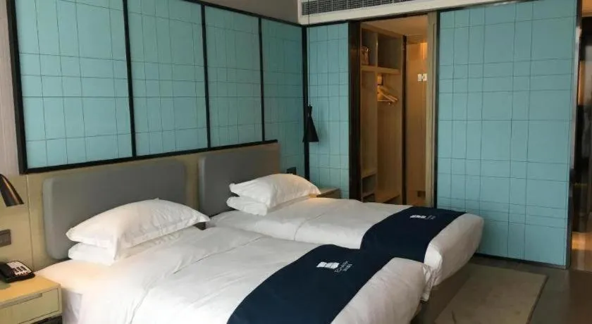 Bed in Echarm Hotel An'xi Hengxing Coach Station