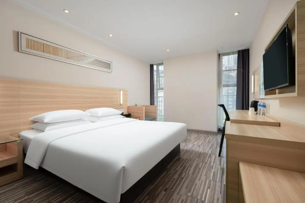 Bed in City Comfort Inn Wuhan Panlongcheng Baishang Shopping Center