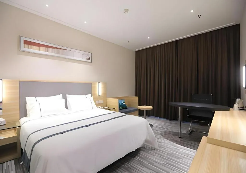 Bed in City Comfort Inn Guangzhou Luyuan Road Taojin Metro Station