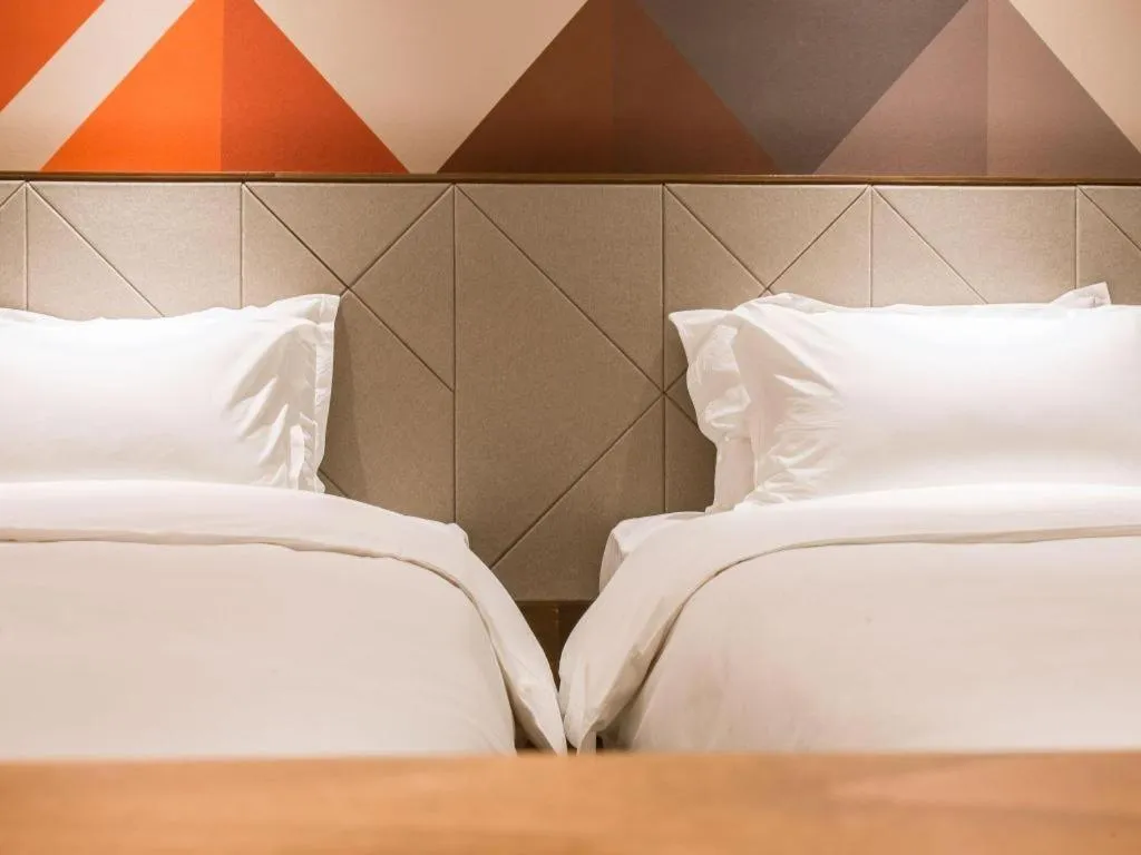 Bed in Borrman Hotel Qianjiang High-speed Railway Station Lobster City