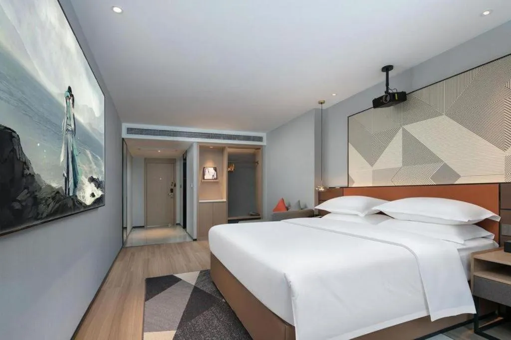 Bed in Borrman Hotel Qianjiang High-speed Railway Station Lobster City