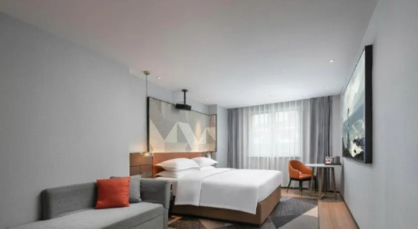 Bed in Borrman Hotel Qianjiang High-speed Railway Station Lobster City