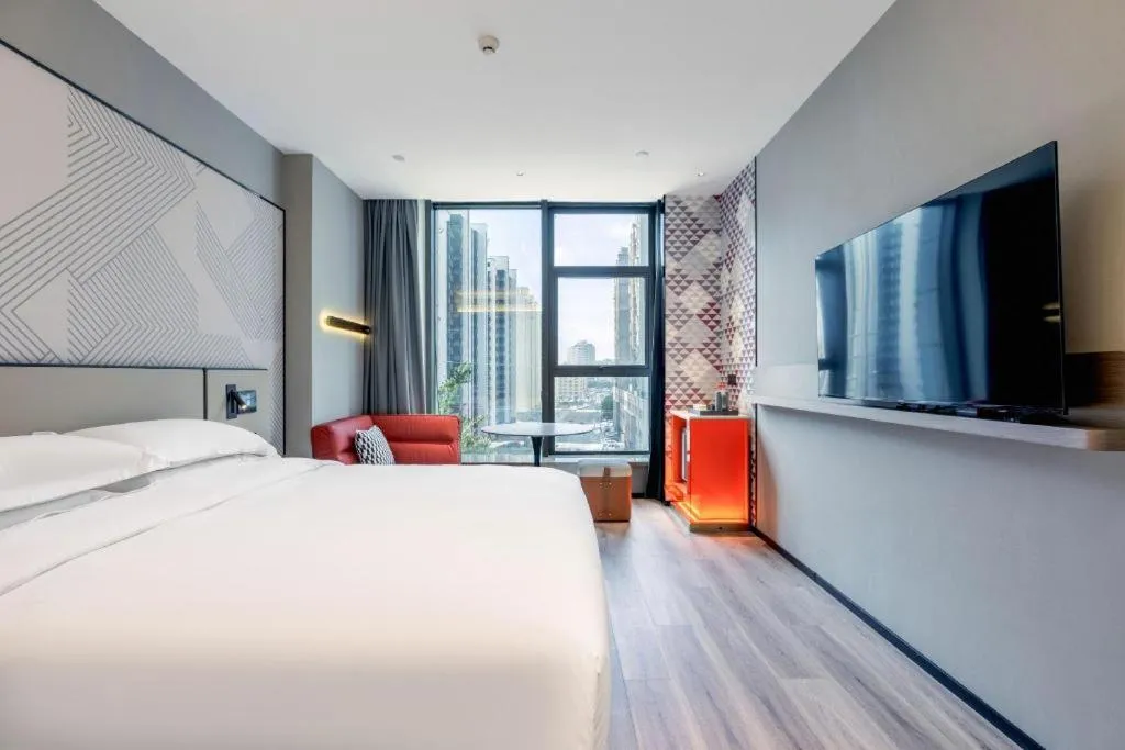 Bed in Borrman Hotel Qianjiang High-speed Railway Station Lobster City