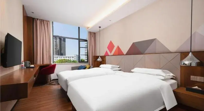Bed in Borrman Hotel Qianjiang High-speed Railway Station Lobster City Bed in Borrman Hotel Qianjiang High-speed Railway Station Lobster City