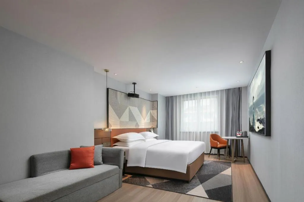 Bed in Borrman Hotel Qianjiang High-speed Railway Station Lobster City