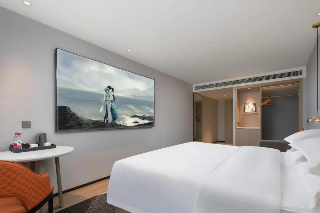 Bed in Borrman Hotel Qianjiang High-speed Railway Station Lobster City