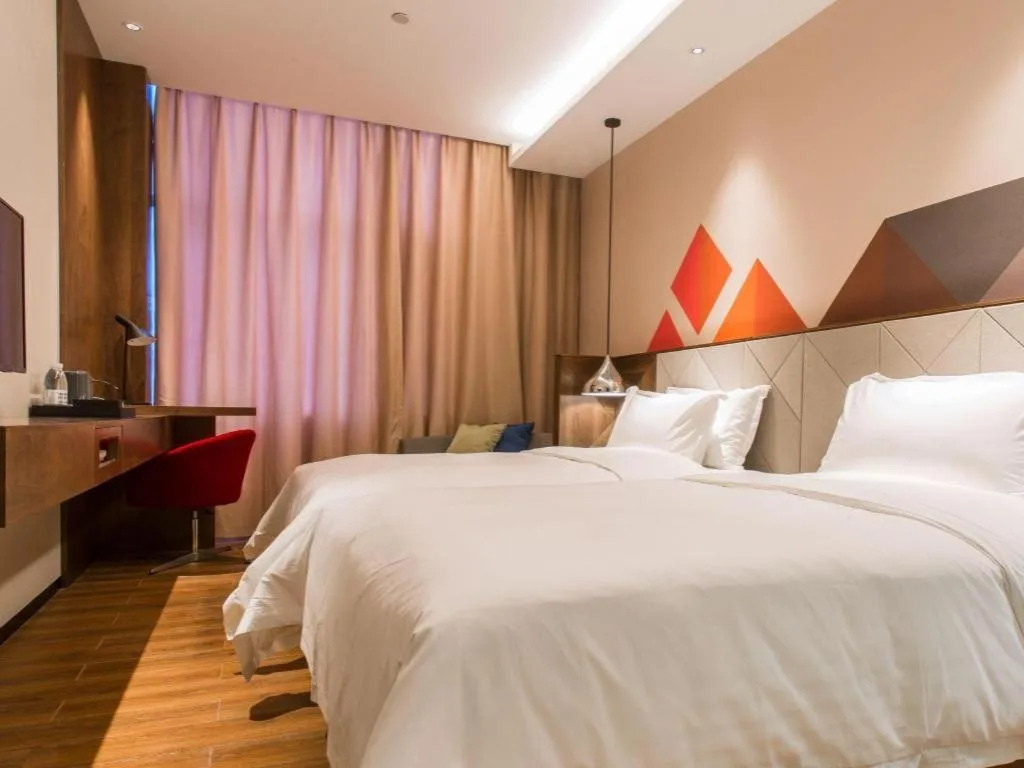 Bed in Borrman Hotel Qianjiang High-speed Railway Station Lobster City