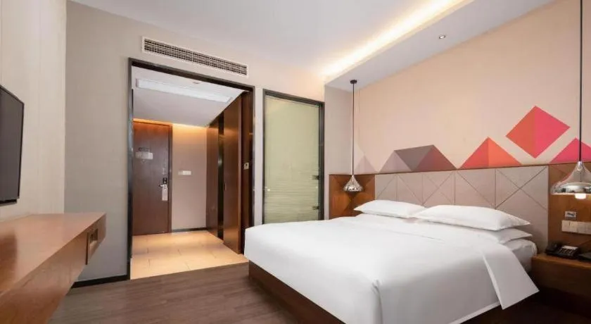 Bed in Borrman Hotel Qianjiang High-speed Railway Station Lobster City