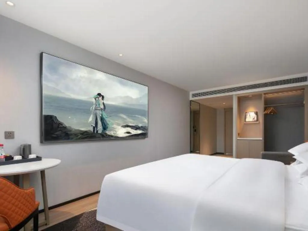 Bed in Borrman Hotel Qianjiang High-speed Railway Station Lobster City