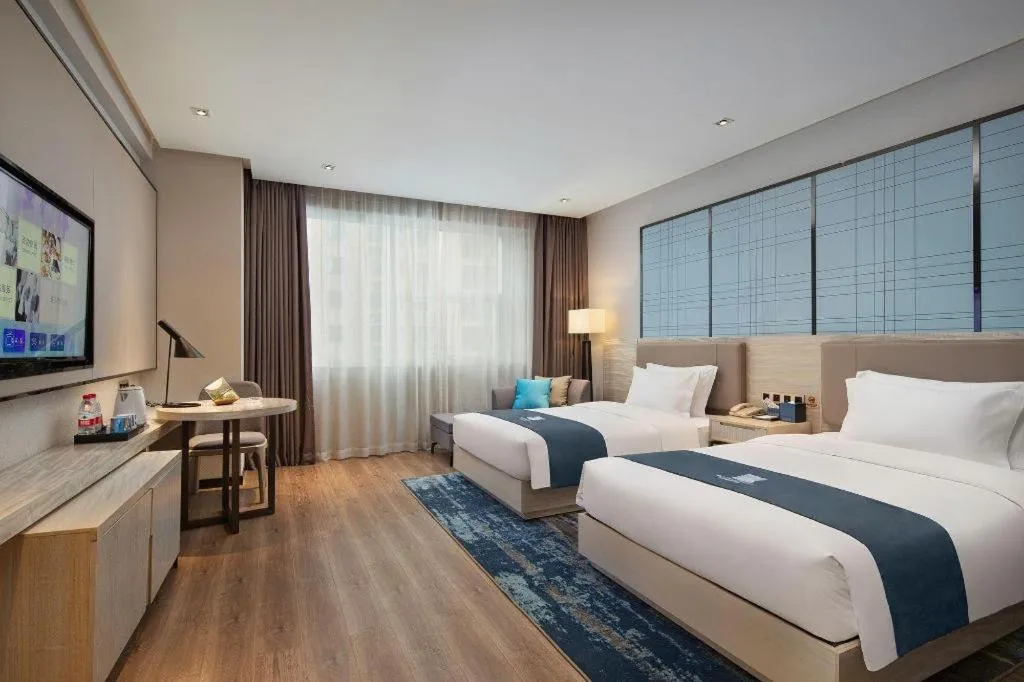 Bed in Echarm Hotel Changsha Gaoqiao