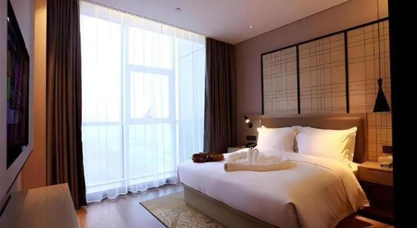 Bed in Echarm Hotel Changsha Gaoqiao
