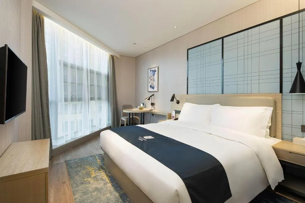 Bed in Echarm Hotel Changsha Gaoqiao