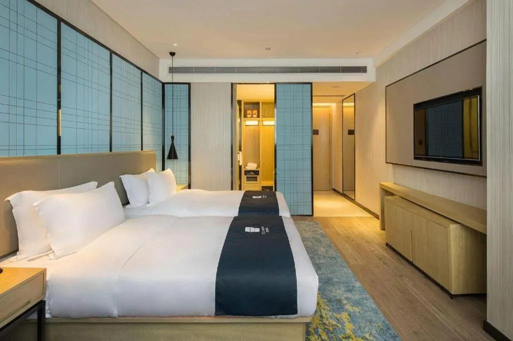 Bed in Echarm Hotel Changsha Gaoqiao