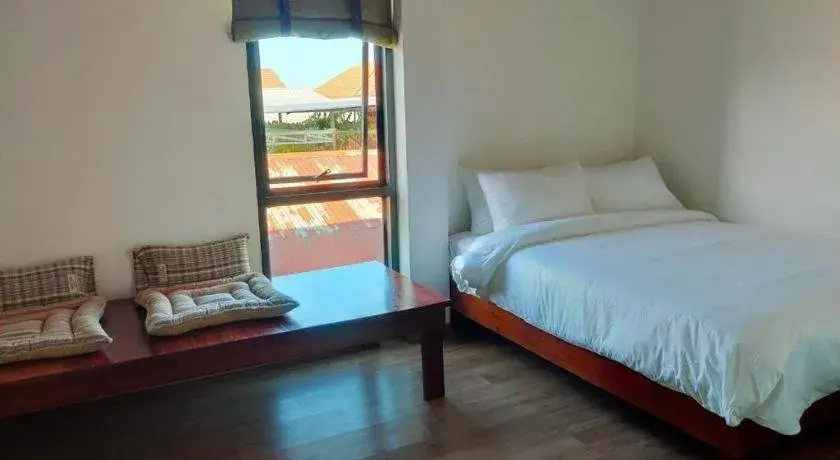 Bed in Thaitara Chiangkhan Bed in Thaitara Chiangkhan