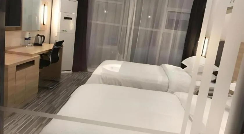 Bed in City Comfort Inn Liu'an Huoshan Dadi Garden