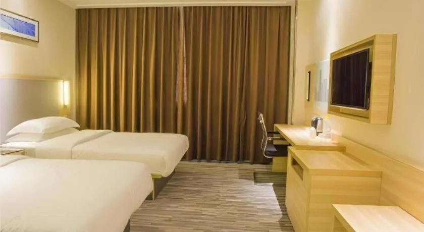 Bed in City Comfort Inn Fangcheng Qunxing Avenue