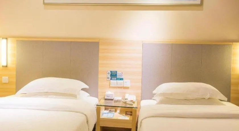 Bed in City Comfort Inn Fangcheng Qunxing Avenue