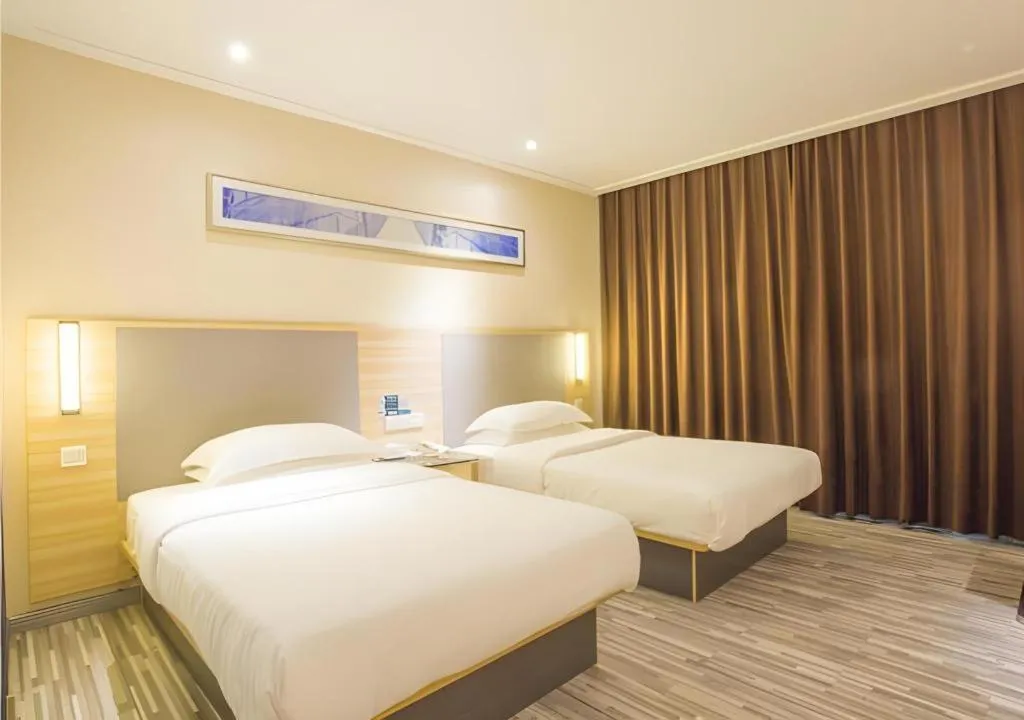 Bed in City Comfort Inn Fangcheng Qunxing Avenue