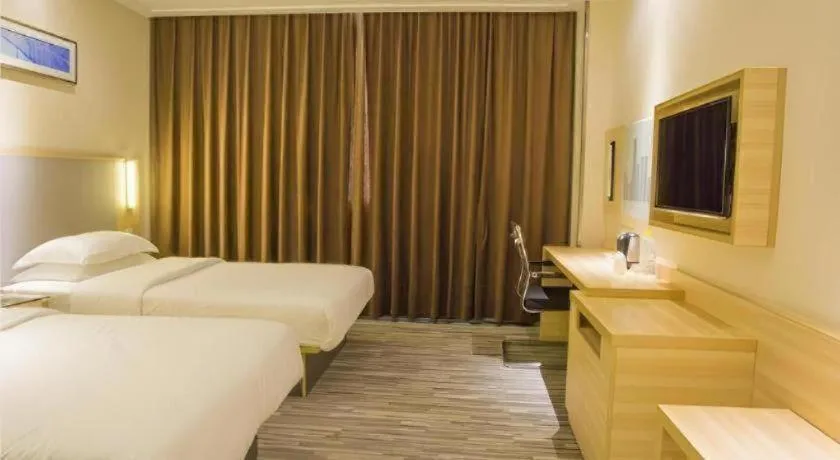 Bed in City Comfort Inn Fangcheng Qunxing Avenue