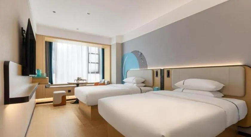 Bed in City Comfort Inn Huanggang Tuanfeng Passenger