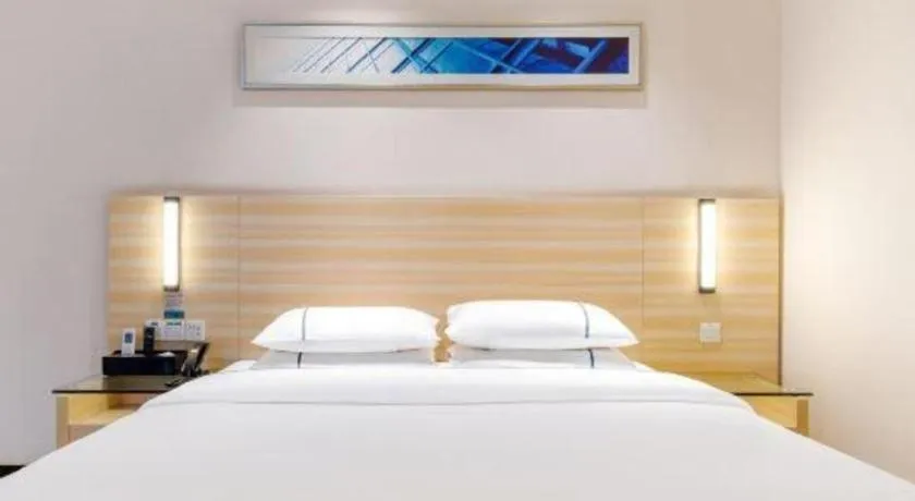 Bed in City Comfort Inn Maoming Xinyi Yudu Park