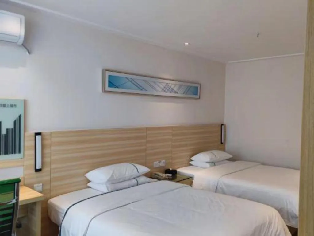 Bed in City Comfort Inn Maoming Xinyi Yudu Park