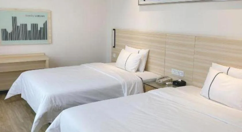 Bed in City Comfort Inn Maoming Xinyi Yudu Park