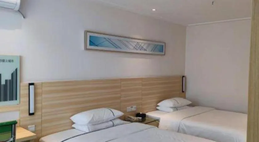 Bed in City Comfort Inn Maoming Xinyi Yudu Park