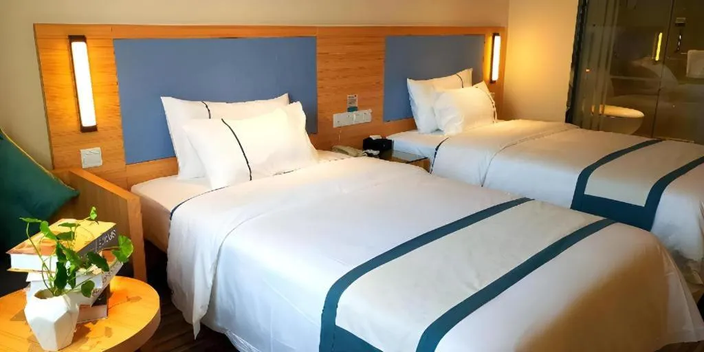 Bed in City Comfort Inn Deyang Shifang Yonghu Park