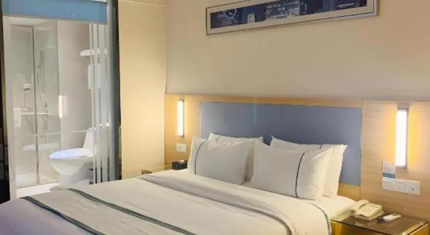 Bed in City Comfort Inn Deyang Shifang Yonghu Park