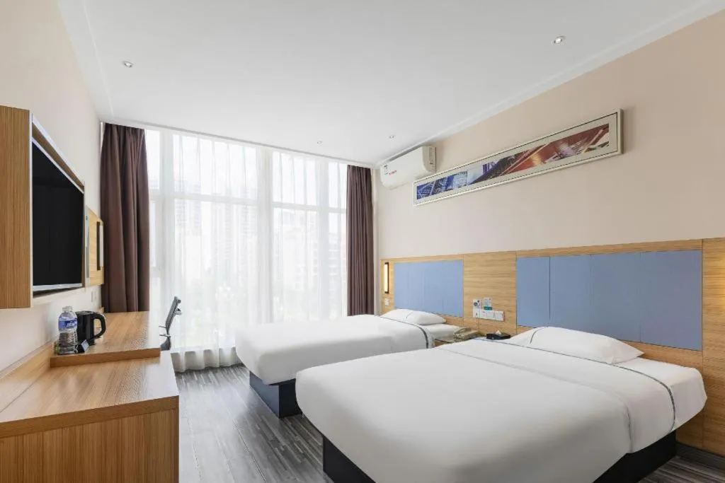 Bed in City Comfort Inn Deyang Shifang Yonghu Park