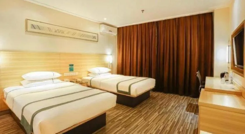 Bed in City Comfort Inn Deyang Shifang Yonghu Park