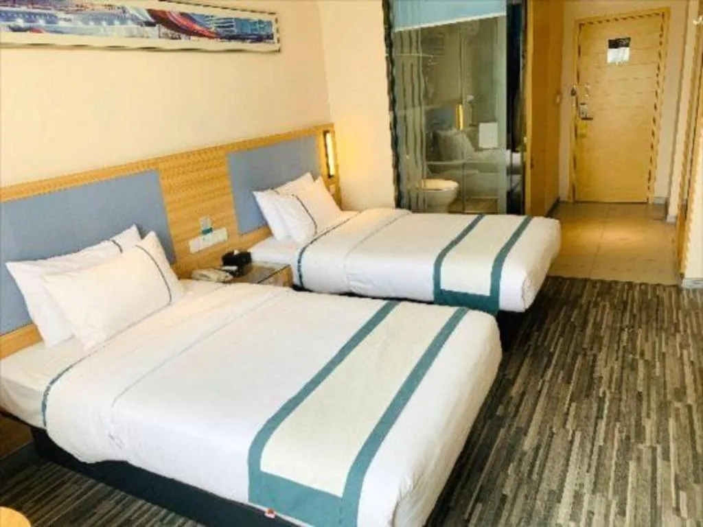 Bed in City Comfort Inn Deyang Shifang Yonghu Park