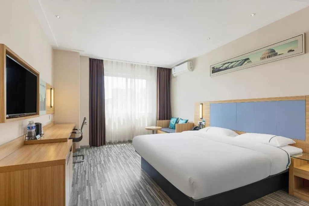 Bed in City Comfort Inn Deyang Shifang Yonghu Park