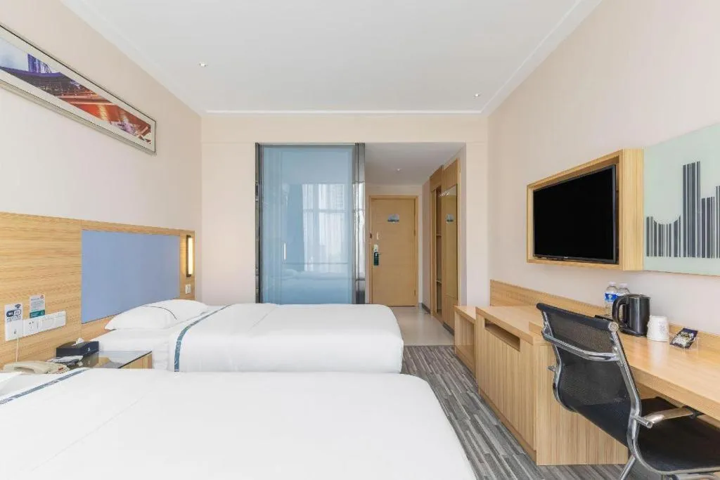 Bed in City Comfort Inn Deyang Shifang Yonghu Park