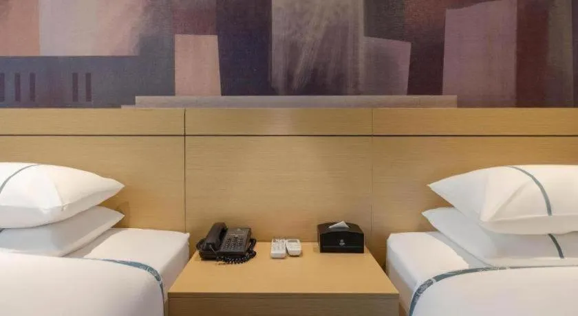 Bed in City Comfort Inn Liuzhou Sanjiang Gulou Bird's Nest