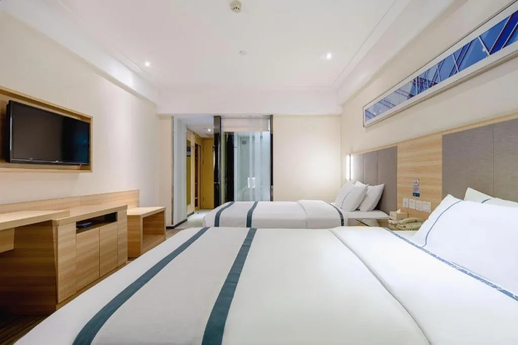 Bed in City Comfort Inn Wuzhou Arcade City Sanzongfu