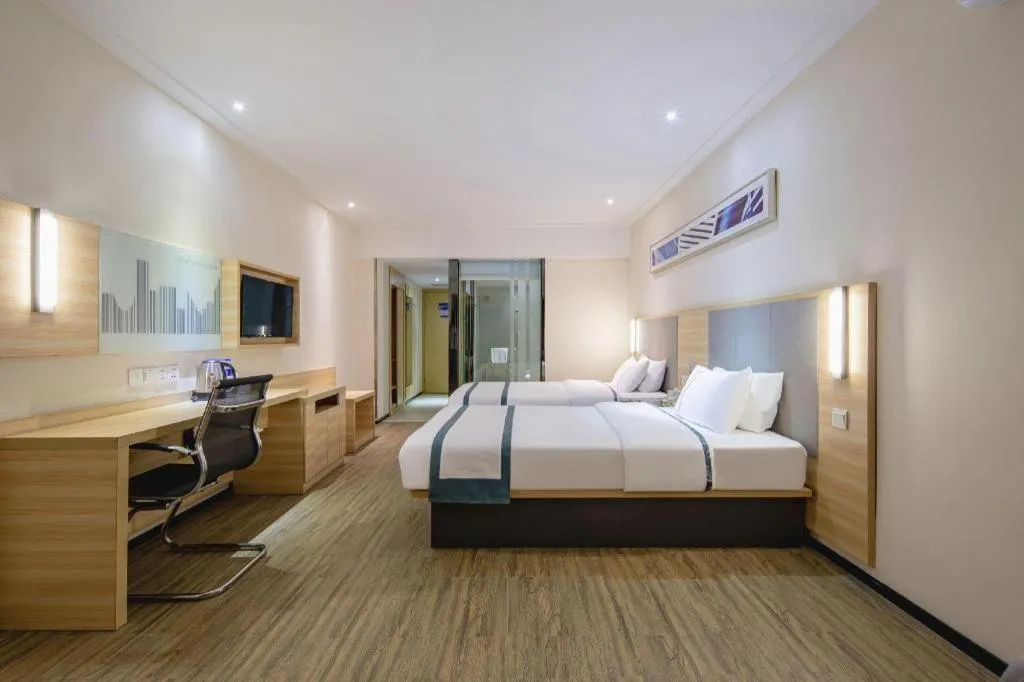 Bed in City Comfort Inn Wuzhou Arcade City Sanzongfu