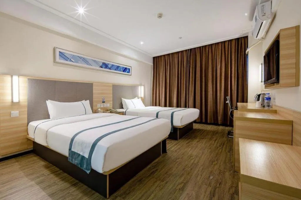 Bed in City Comfort Inn Wuzhou Arcade City Sanzongfu