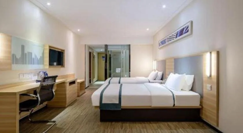 Bed in City Comfort Inn Wuzhou Arcade City Sanzongfu