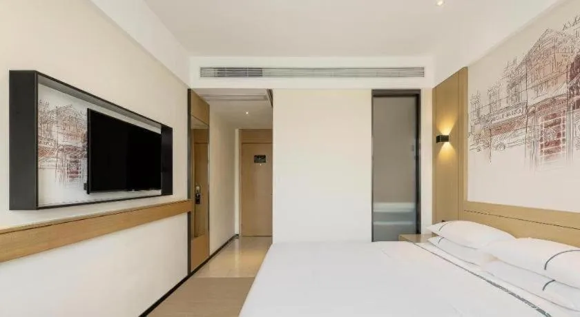 Bed in City Comfort Inn Zunyi Wuchuan