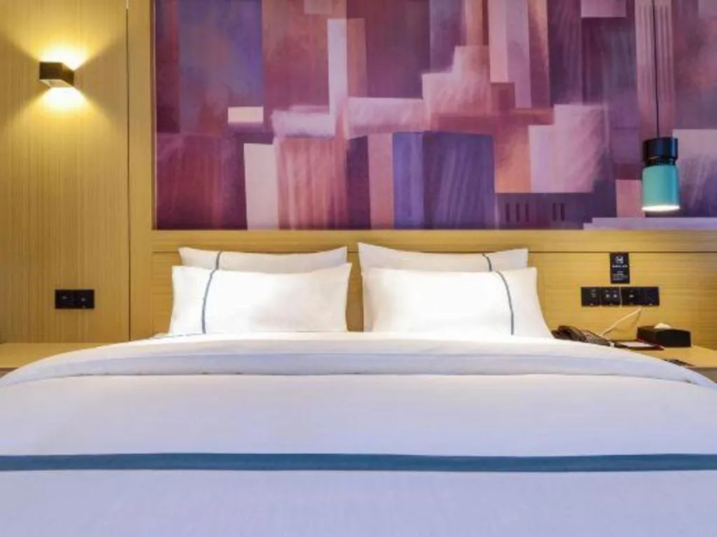 Bed in City Comfort Inn Zunyi Wuchuan