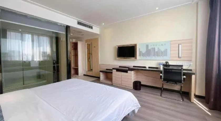 Bed in City Comfort Inn Huanggang Dongmen Road Wanda Plaza